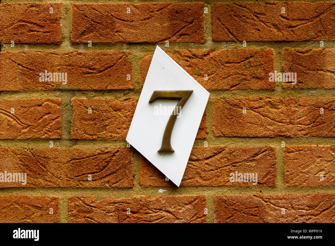 House number 7 on a red brick wall Stock Photo Alamy