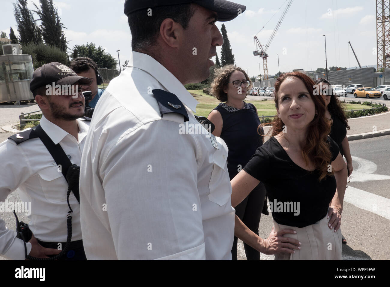 Jerusalem, Israel. 9th September, 2019. STAV SHAFFIR (R), former Labor MK and leader of 2011 Israeli social justice protests, number 2 on the the Democratic Union list, exchanges words with Knesset Guard as activists block the access road to the Israeli Parliament. Credit: Nir Alon/Alamy Live News Stock Photo