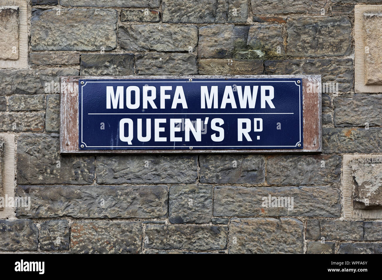 Pictured: Queen's Road (Morfa Mawr) road sign on the old Police Station in Aberystwyth, Wales, UK. Wednesday 28 August 2019 Re: Opened 1866, built by Stock Photo