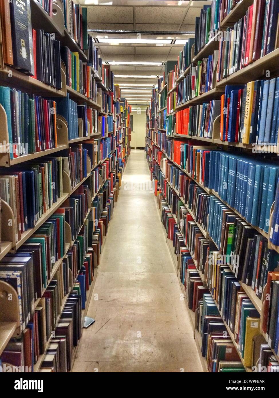 Books arranged in shelf hires stock photography and images Alamy