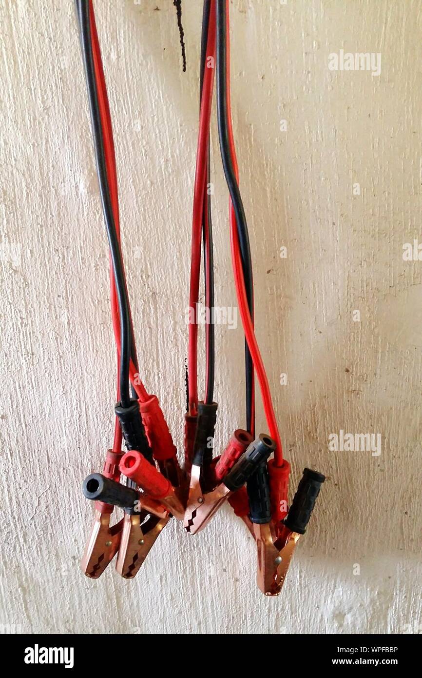 Closeup Of Cables With Electric Clips Against Wall Stock Photo Alamy
