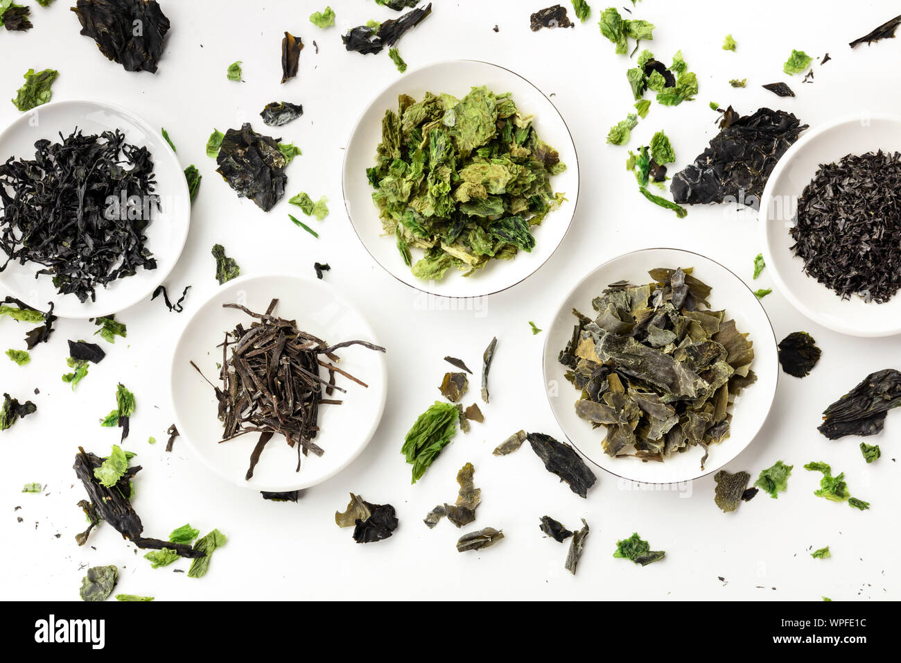 Various dry seaweed, sea vegetables, shot from above on white. Superfoods background Stock Photo