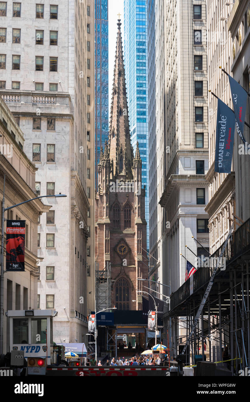 Trinity Church New York, view from Wall Street of the tower and spire of Trinity Church (1846), Lower Manhattan, Financial District, New York City, Stock Photo