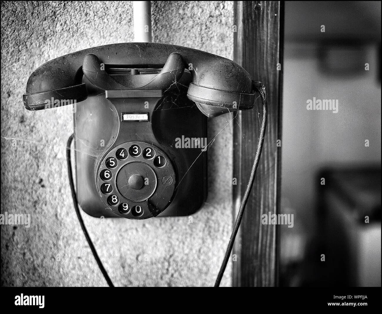 Old telephone mounted on wall hi-res stock photography and images - Alamy