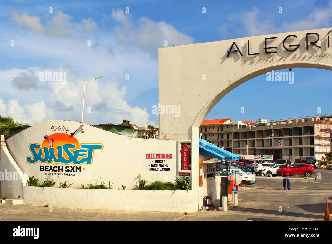 Entrance to the car park for the 'Sunset Beach SXM' beach bar, popular with tourists & plane-spotters, due to its location by SXM airport, St Maarten. Stock Photo