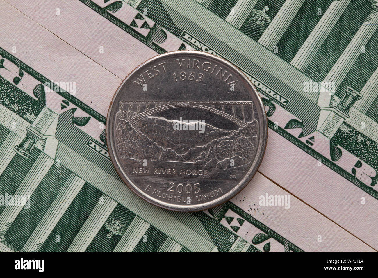 A quarter of West Virginia on US dollar bills. Symmetric composition of