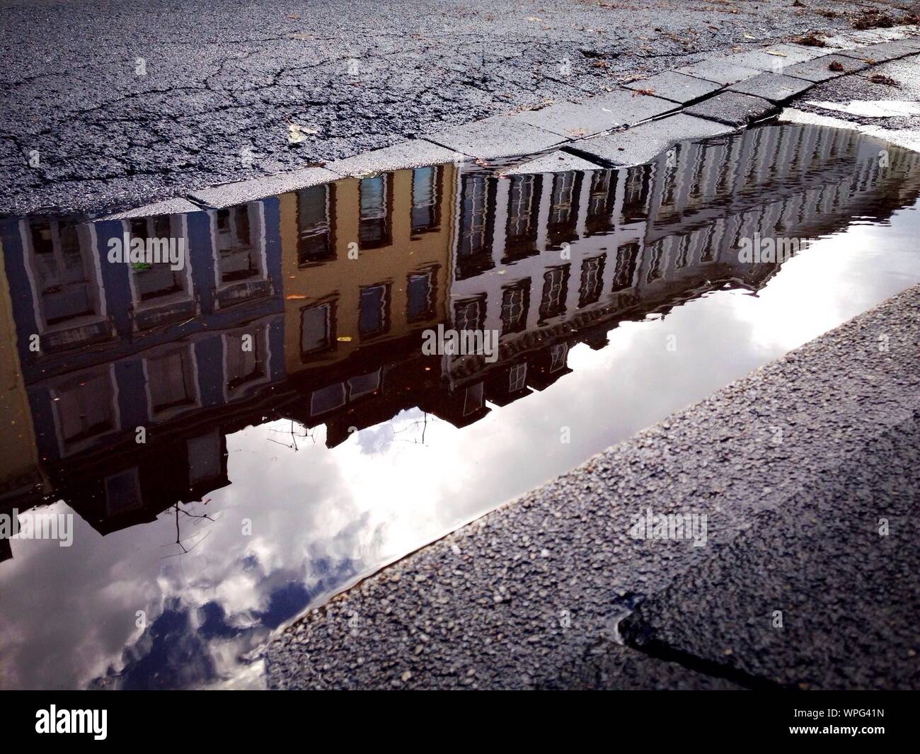 Reflection of buildings in puddle hi-res stock photography and images ...