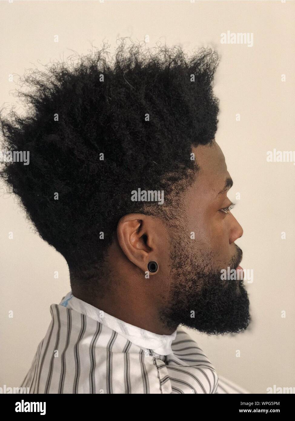 Side View Of Man With Curly Hair Stock Photo - Alamy