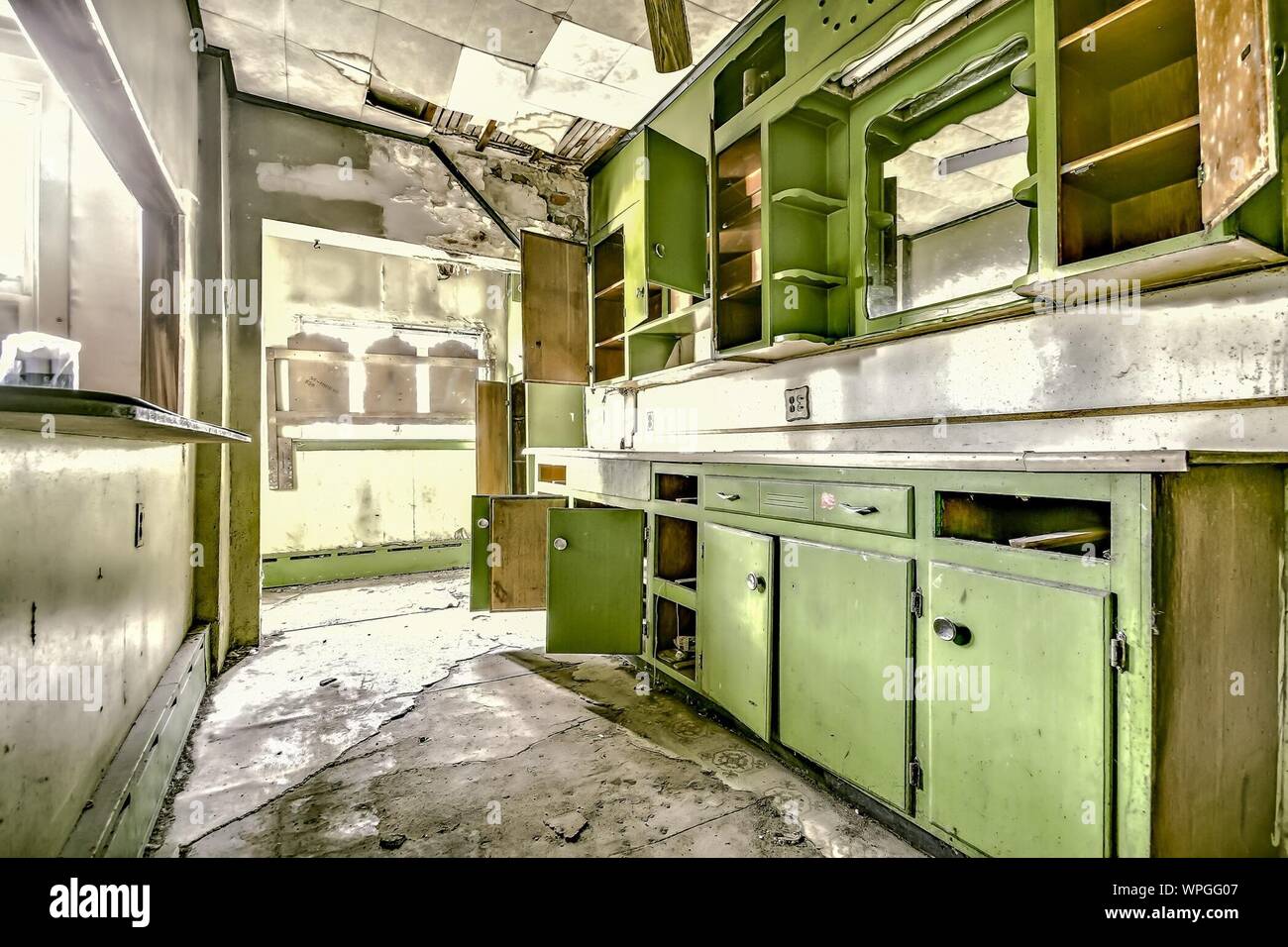 Abandoned Domestic Kitchen With Cabinets Stock Photo