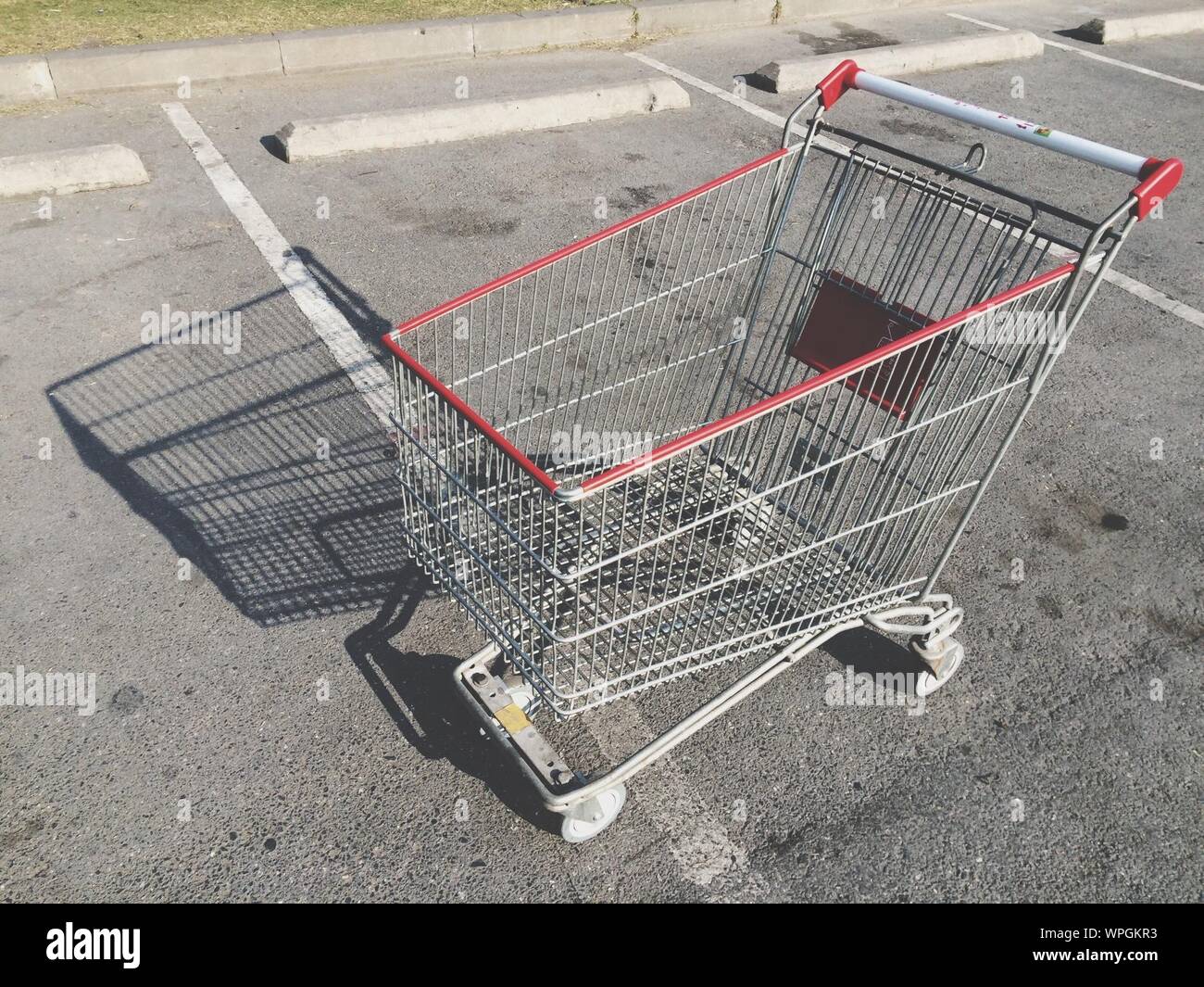 Shopping Cart In Parking Lot High Resolution Stock Photography and