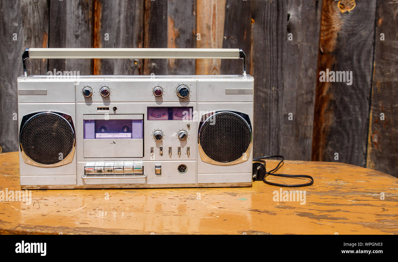 retro cassette player on wooden table outdoor closeup Stock Photo