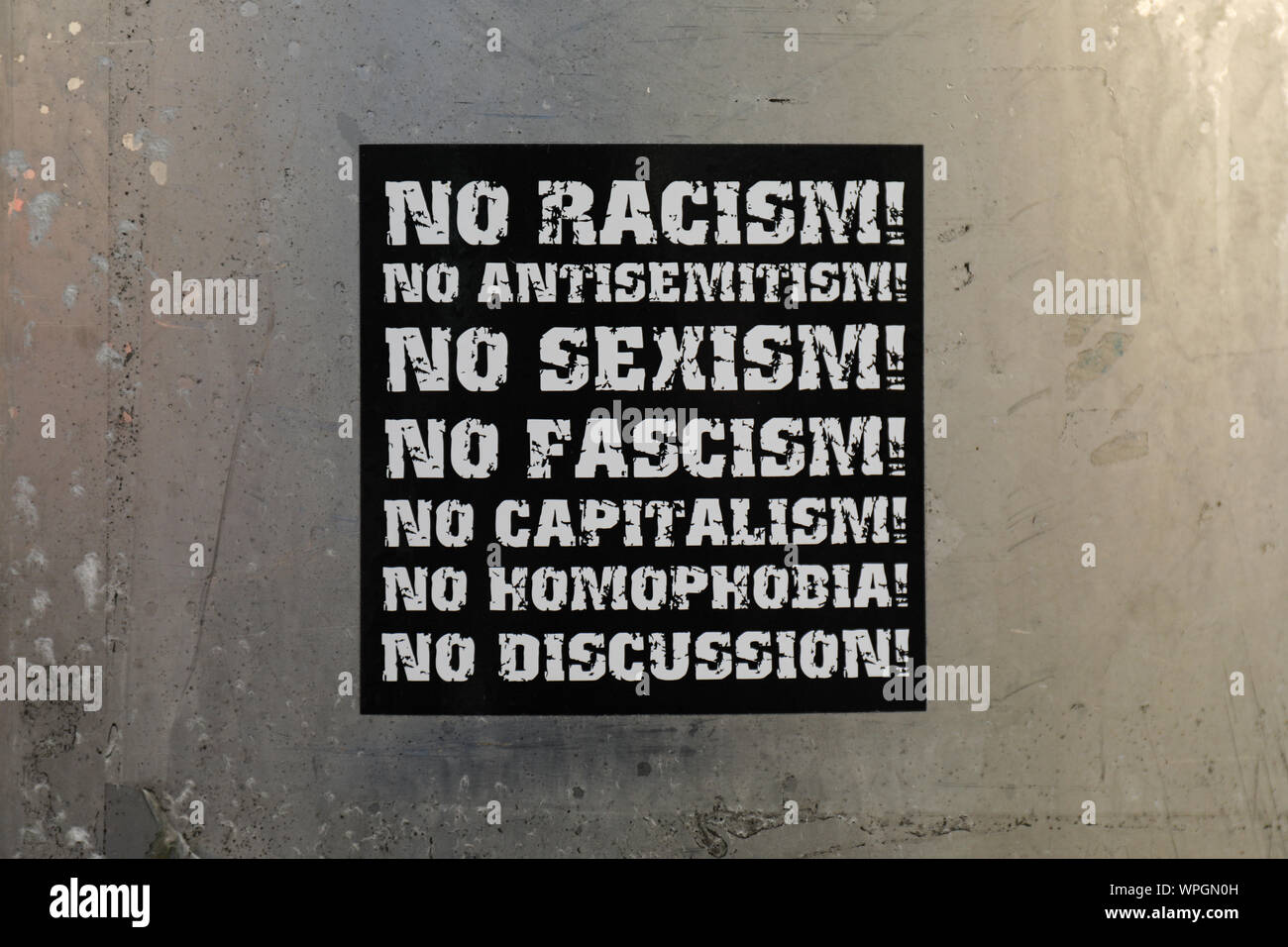 Anti-fascism sticker on concrete wall Stock Photo