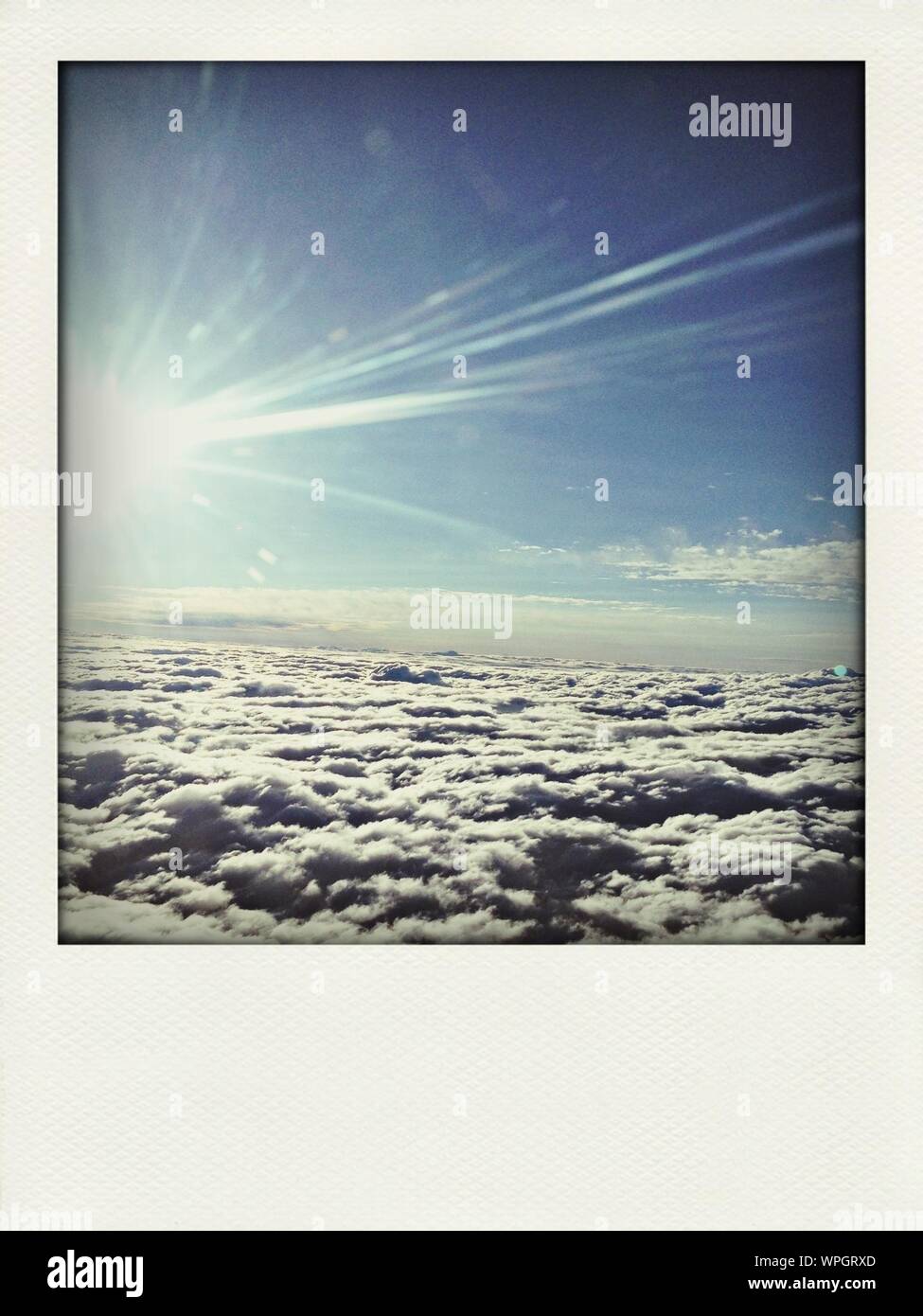 Sunlight in sky with clouds hi-res stock photography and images - Alamy