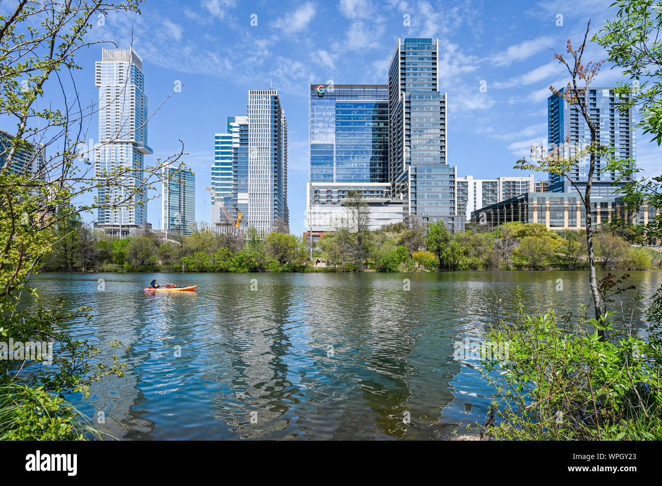 Austin skyline and Colorado river during spring viewed from Town Lake Metropolitan Park in Austin Texas. Stock Photo