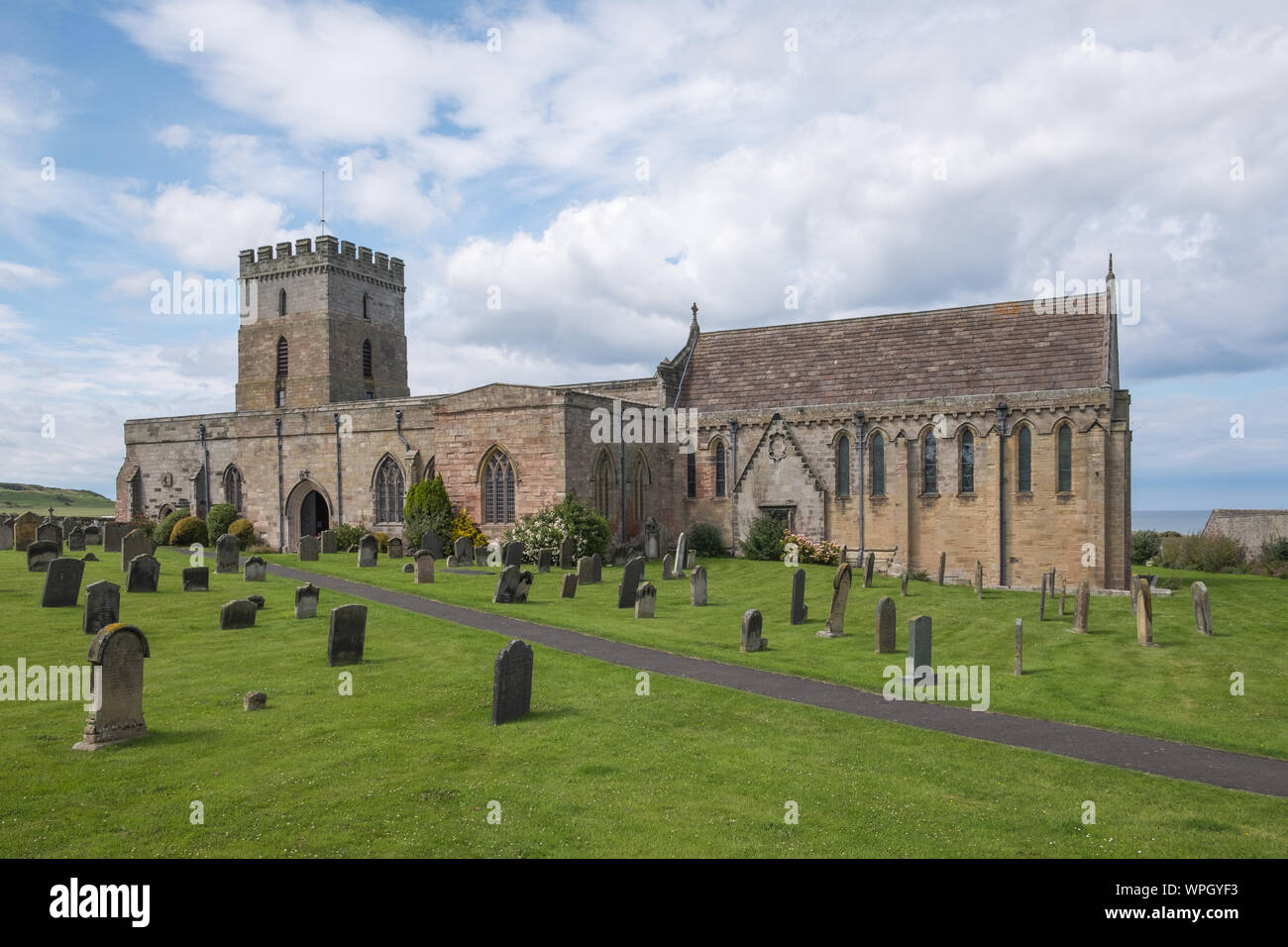 St Aidan's Church in the village of Bamburgh on the Northumberland coast, UK Stock Photo