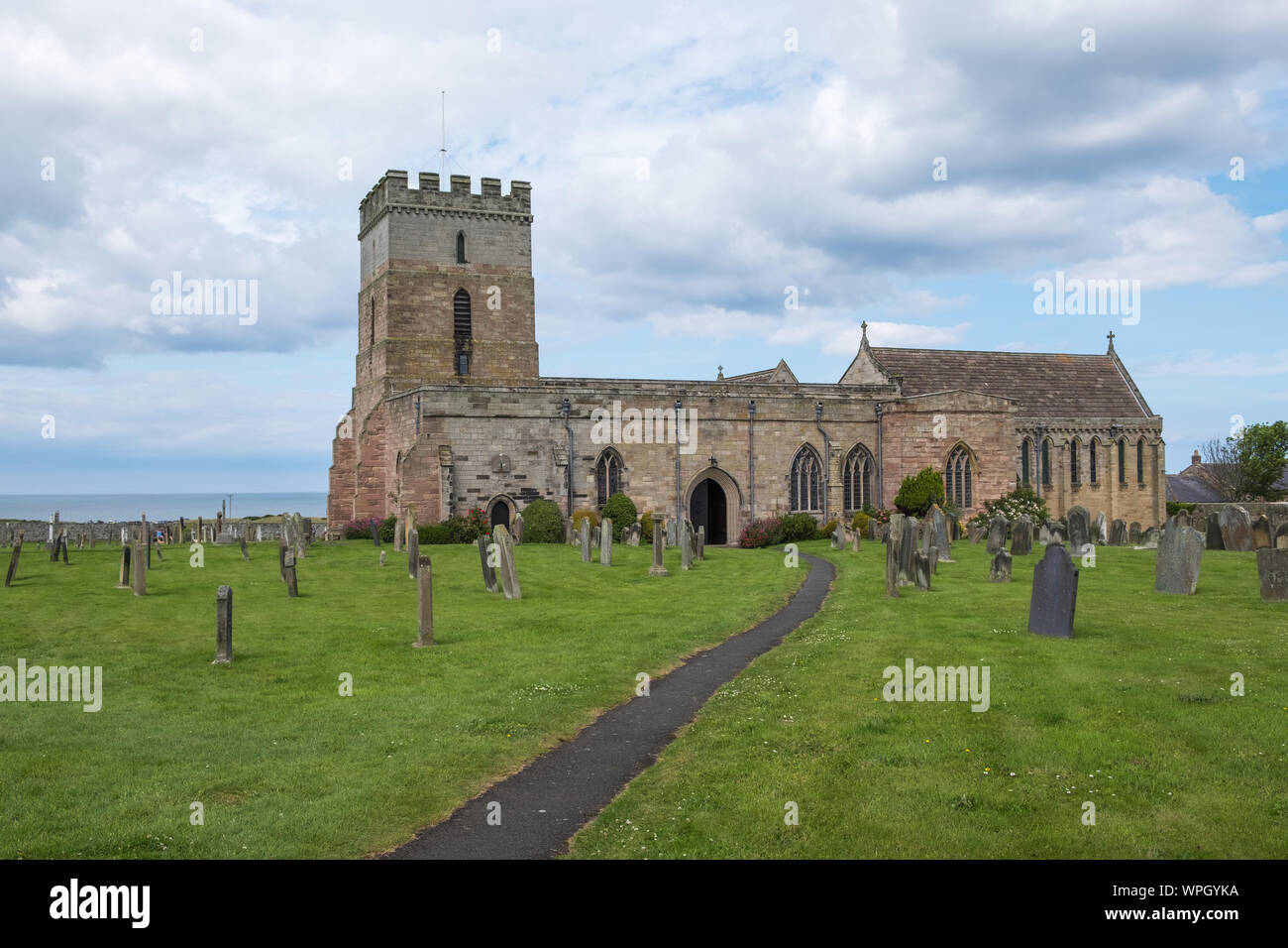 St Aidan's Church in the village of Bamburgh on the Northumberland coast, UK Stock Photo