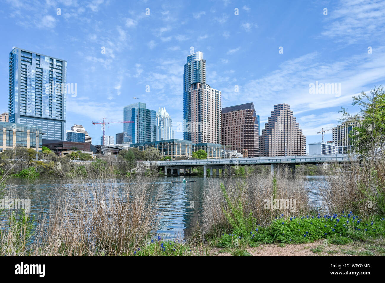 Austin skyline and Colorado river during spring viewed from Town Lake Metropolitan Park in Austin Texas. Stock Photo