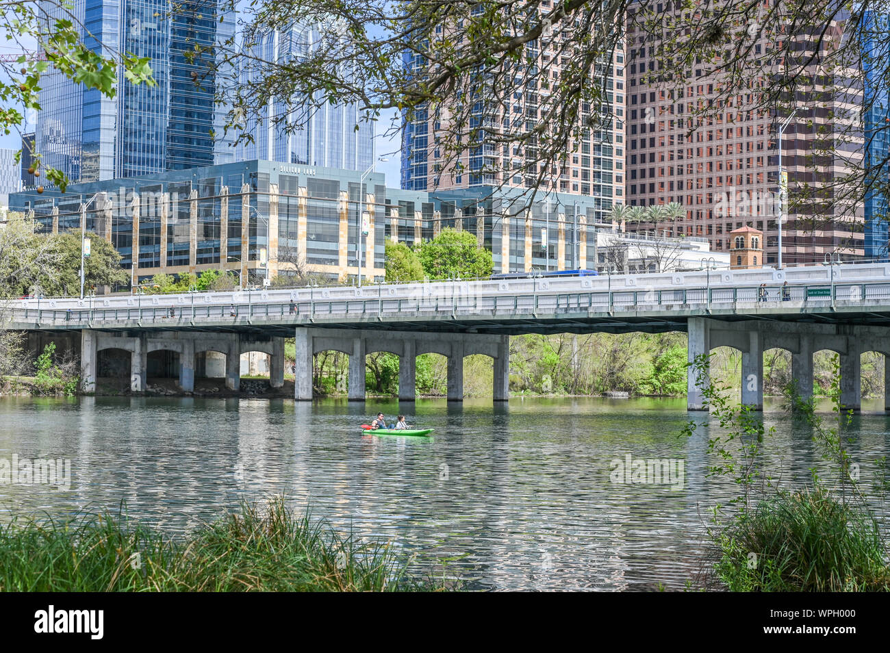 South 1st Street bridge and Colorado river in Ausitin, Texas viewed from Auditorium Shores in March 2019 Stock Photo