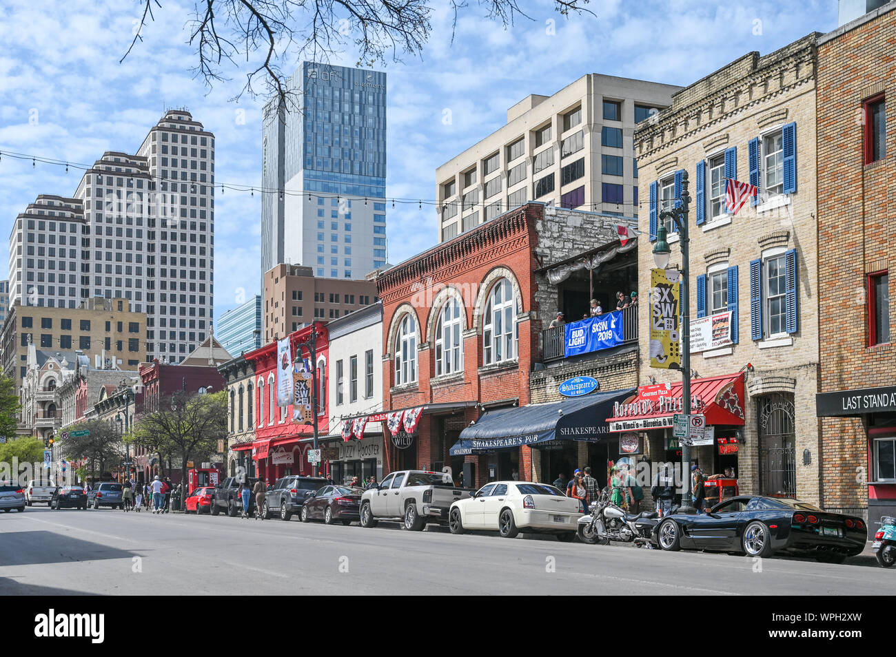Sixth Street in Austin Texas during SXSW festival in March 2019. This historic street is famous for its live music bars. Stock Photo