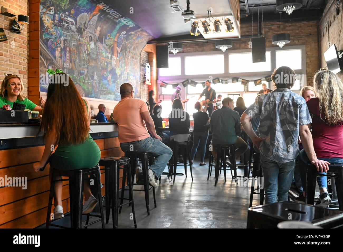 Sixth Street bar Maggie Maes in Austin Texas during St Patricks day in March 2019. This historic street is famous for its live music bars. Stock Photo