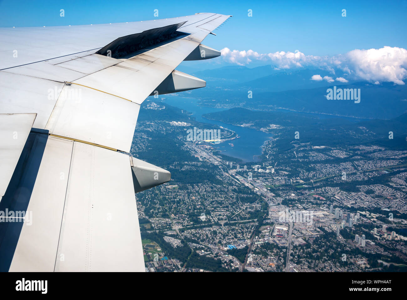 Aerial view of the area of Coquitlam near Vancouver, Canada and the wing of a plane Stock Photo