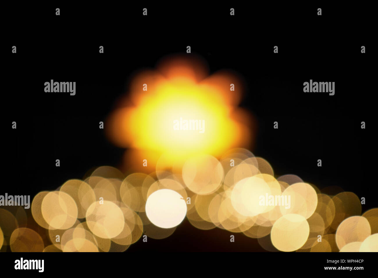 Christmas star as a blurred round bright lens effects. As a Christmas decoration. Stock Photo