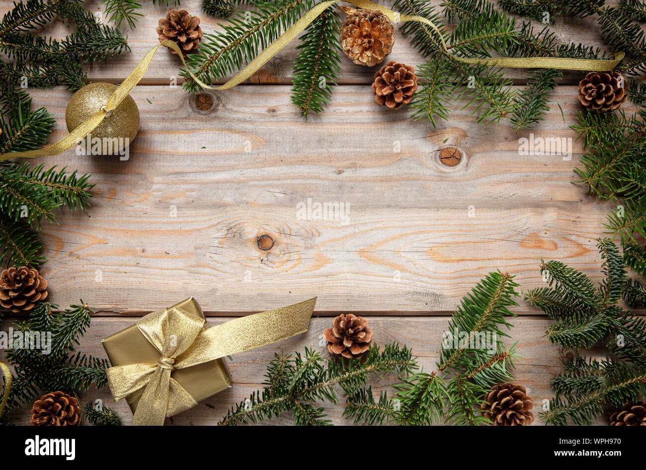 Christmas greenery and decorations against a rustic wood backdrop Stock  Photo - Alamy