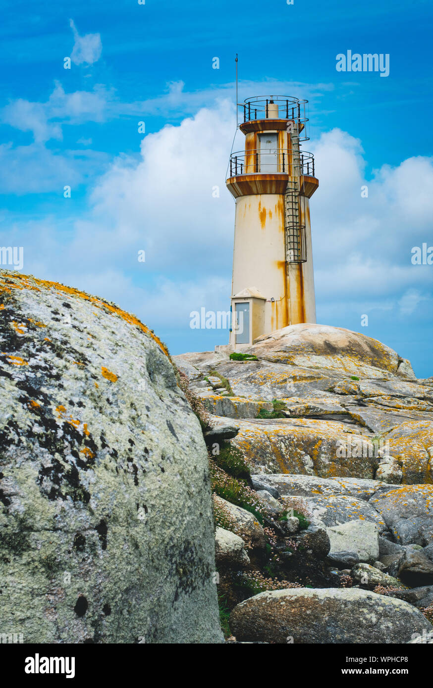 Old rusty lighthouse in Muxia, Spain. Stock Photo