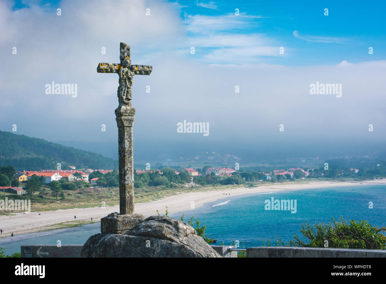 Cross monument standing on Fisterra shore in Spain. Stock Photo