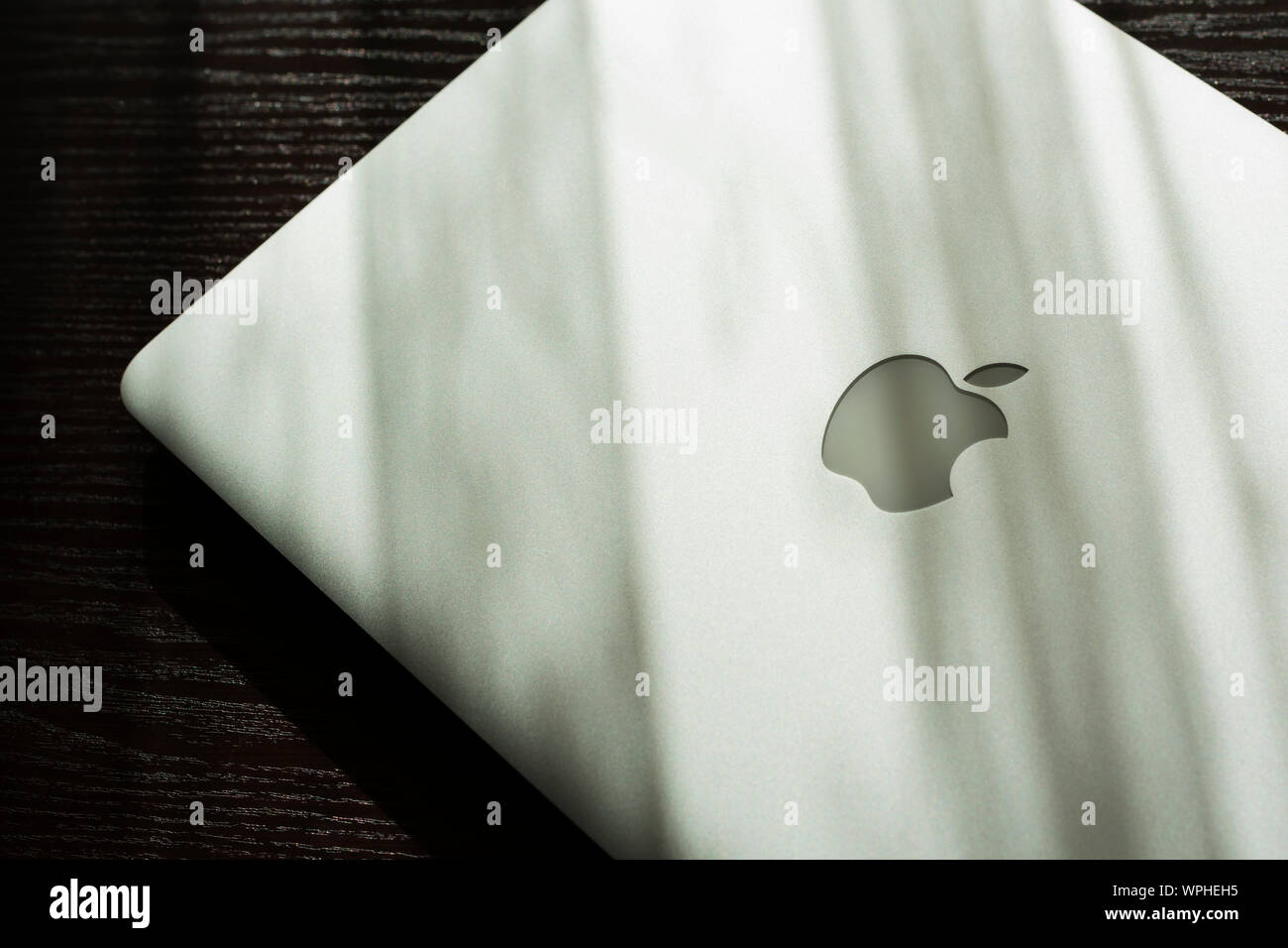 MacBook Air on sunny table. Stock Photo