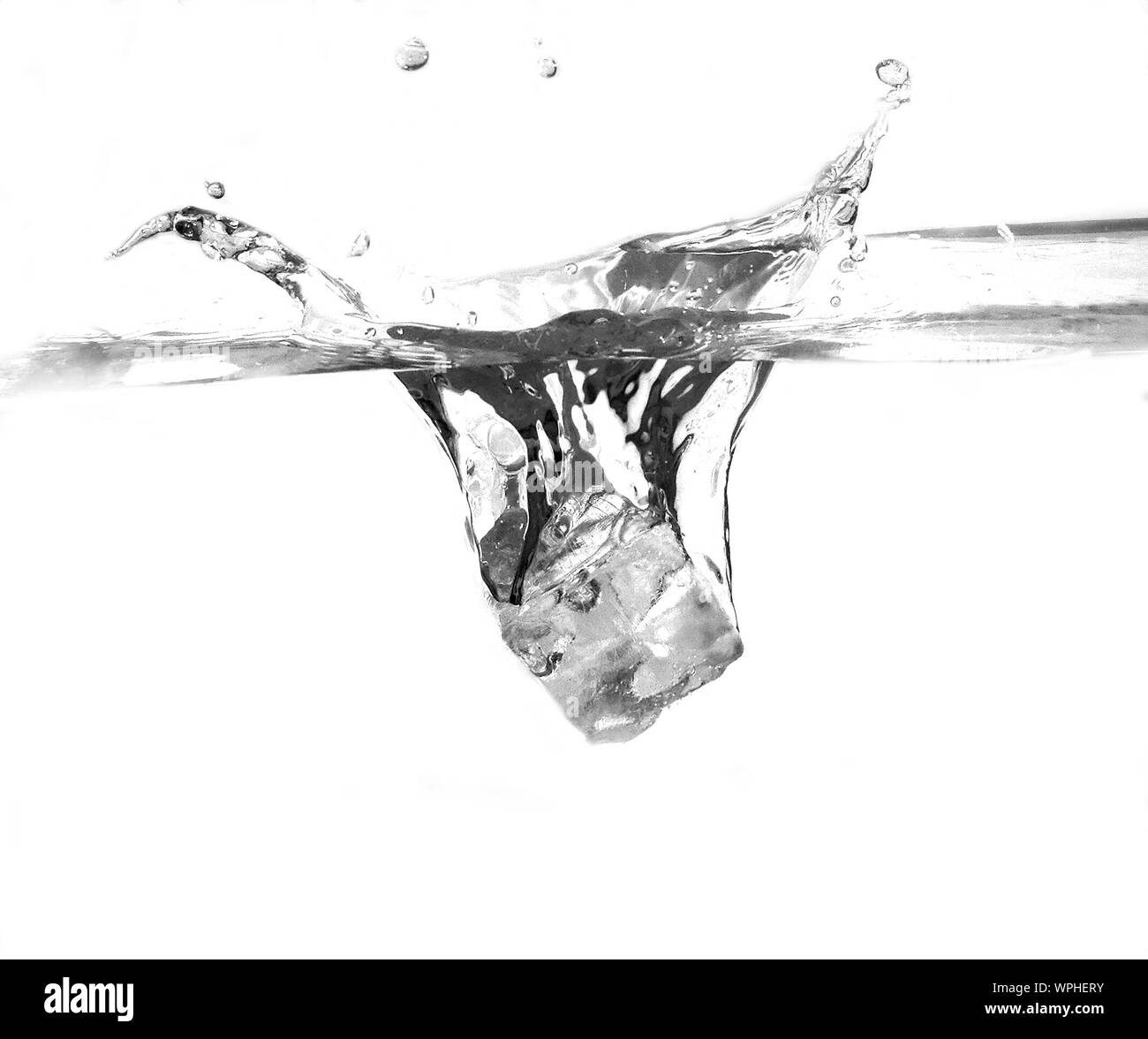 Ice Cube Splashing Into Water Stock Photo