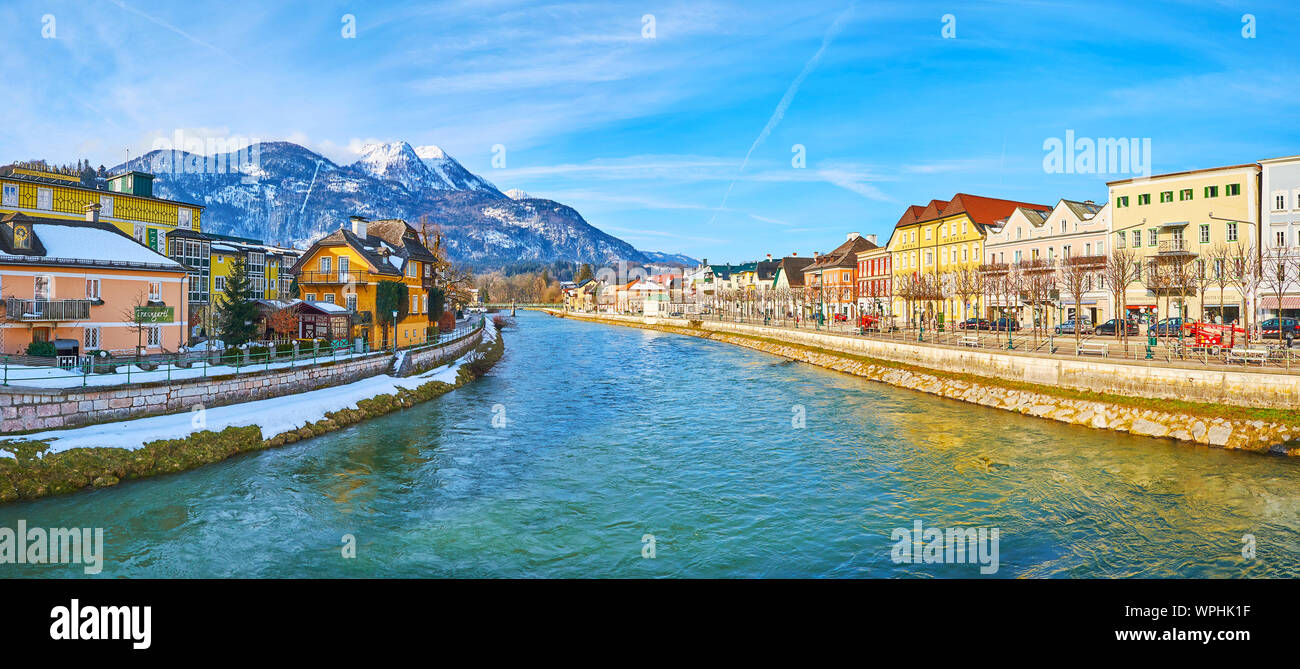 BAD ISCHL, AUSTRIA - FEBRUARY 23, 2019: The sunny winter morning in old town with a view on Traun river, its banks with historical edifices and Mount Stock Photo