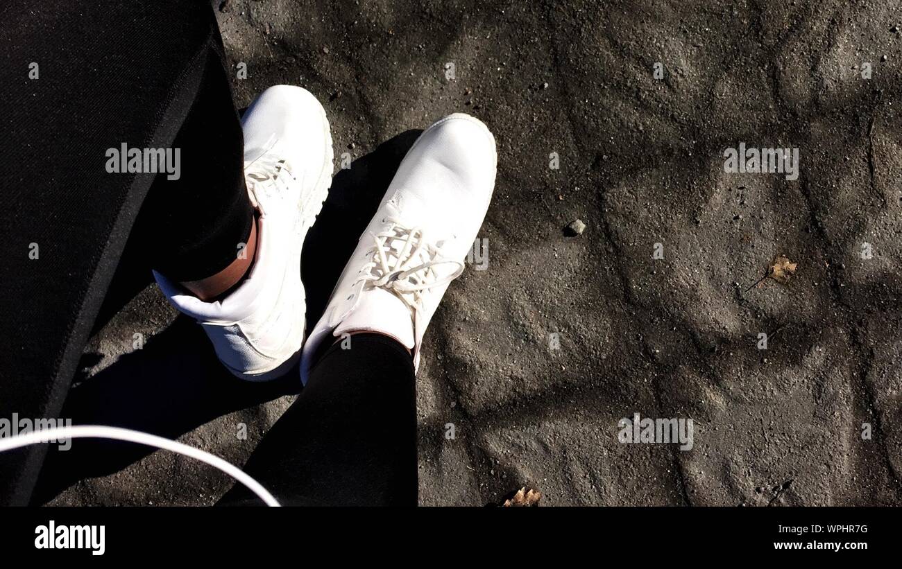 Wearing white trainers hi-res stock photography and images - Alamy