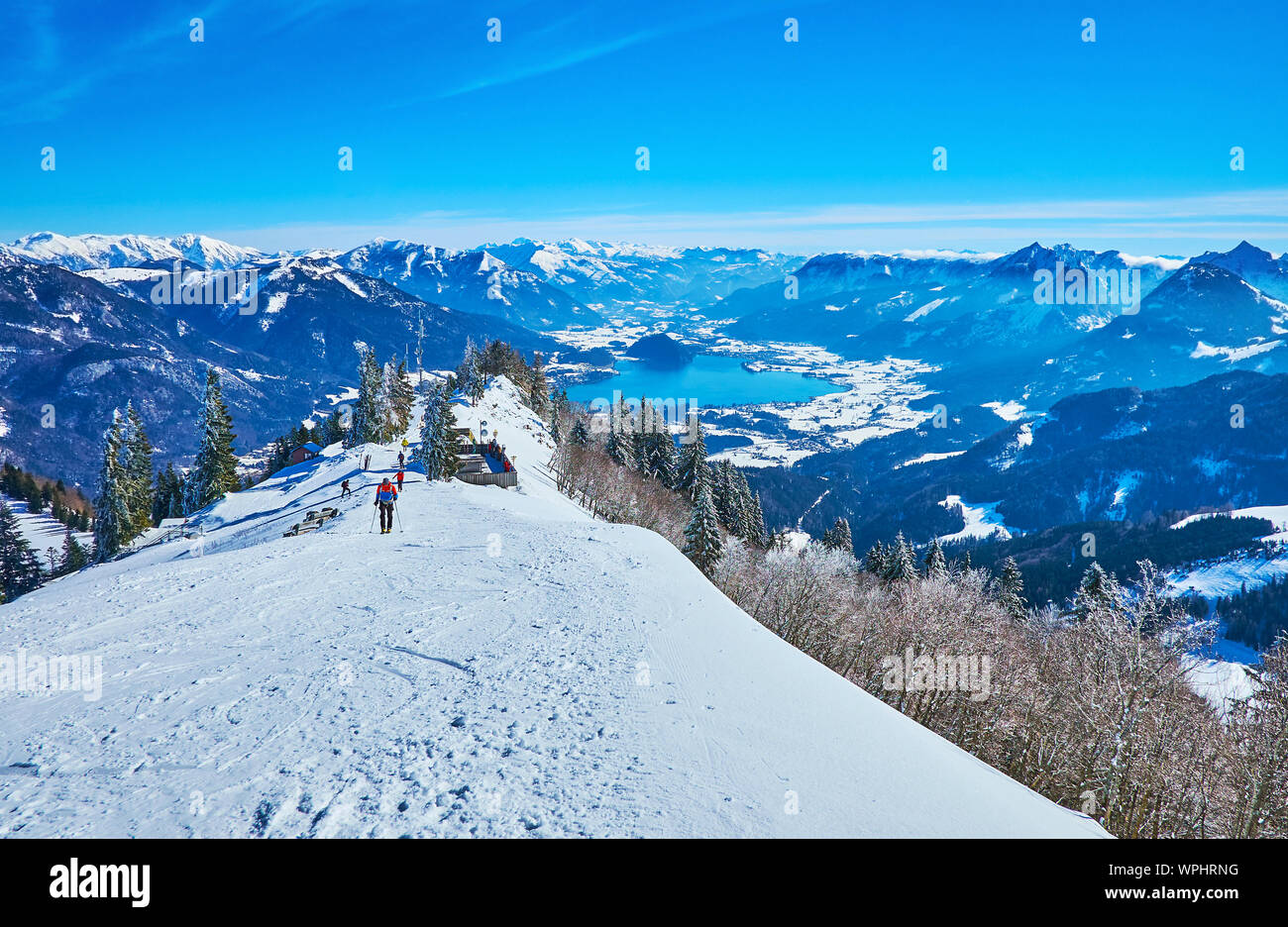 The peak of Zwolferhorn mount is best place to overlook Wolfgangsee lake, Alpine scenery and watch the skiers on downhill, St Gilgen, Salzkammergut, A Stock Photo
