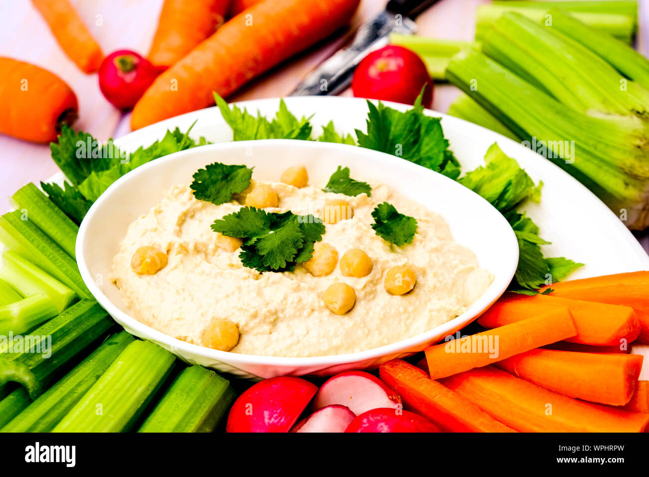 Mediterranean Hummus With Fresh Vegetables Including Carrots, Celery