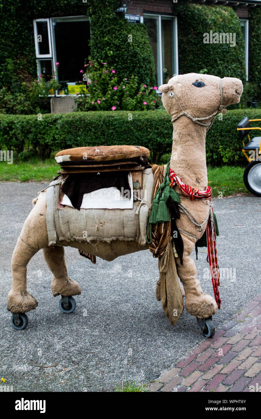 Picture of a large toy camel on wheels used for carrying children pictured in Buren, Ameland, in September 2019 Stock Photo