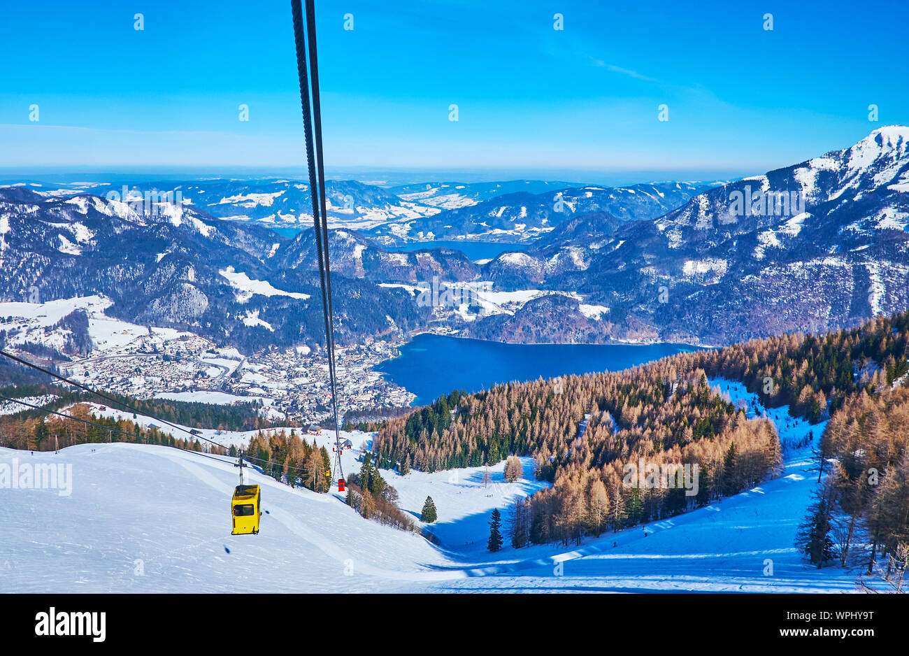 Zwolferhorn cable car is the most popular tourist attraction in St Gilgen, the steep mountain slope opens the view on Wolfgangsee lake and spectacular Stock Photo