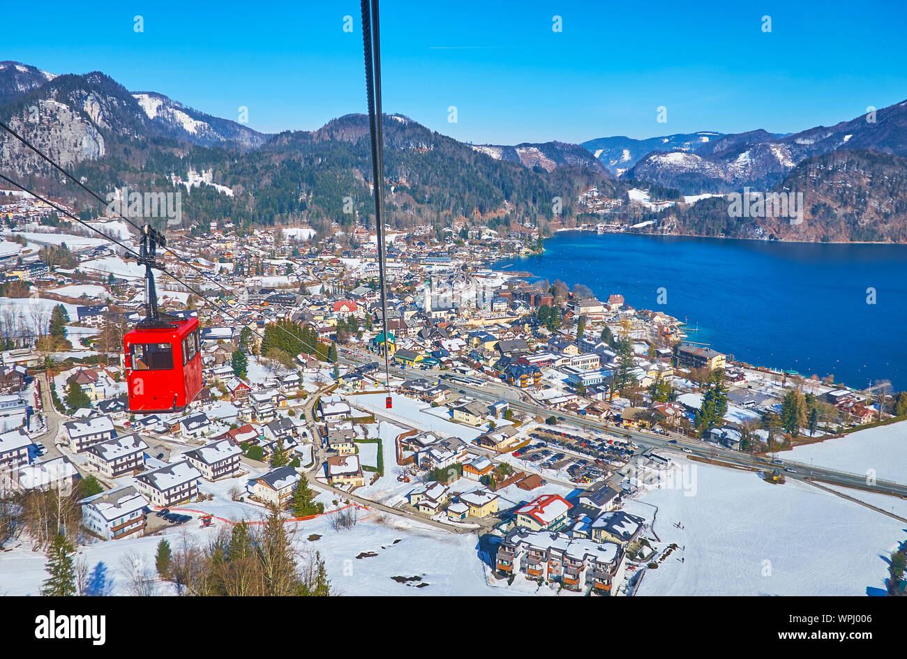 The view from the Zwolferhorn cable car on snowy village of St Gilgen, located on the bank of Wolfgangsee lake, Salzkammergut, Austria Stock Photo