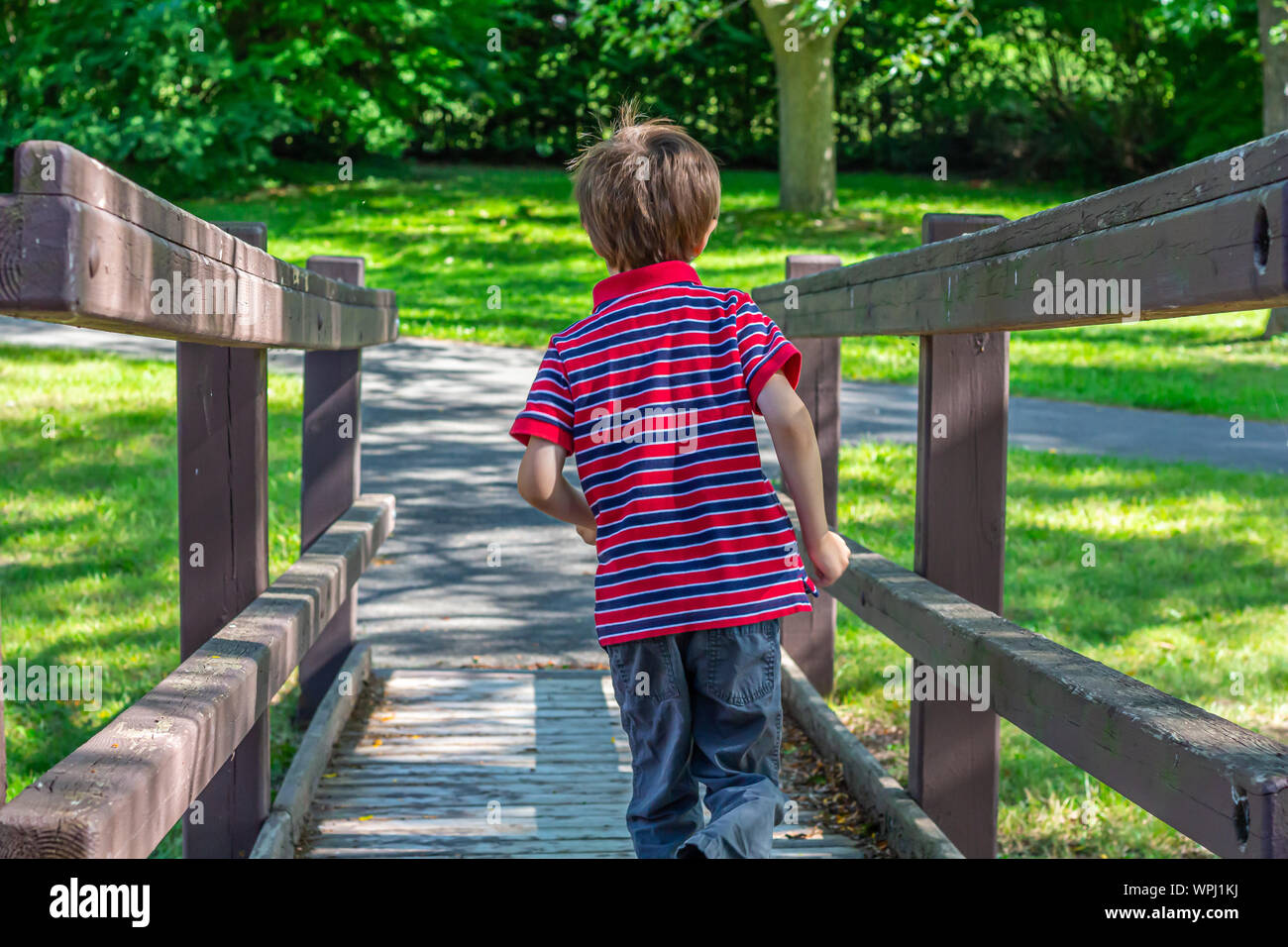 Boy facing down hi-res stock photography and images - Alamy