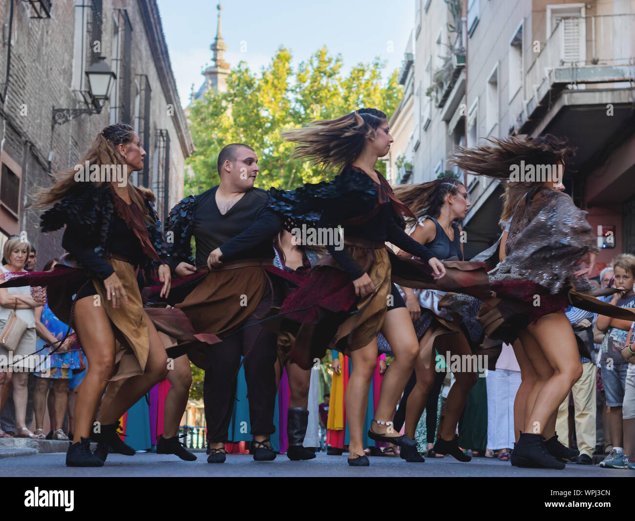 Alma Talavera Dance Company dancing tribal dances. Improvised tribal dance in the street. Spinning dancers. Talavera de la Reina, Spain, September 8, Stock Photo