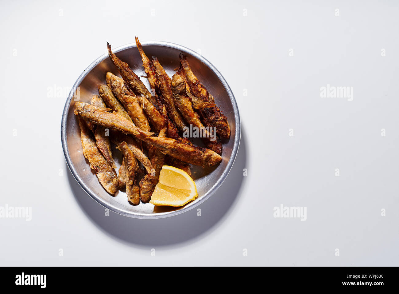 Red mullet fish deepfried and served with lemon Stock Photo Alamy