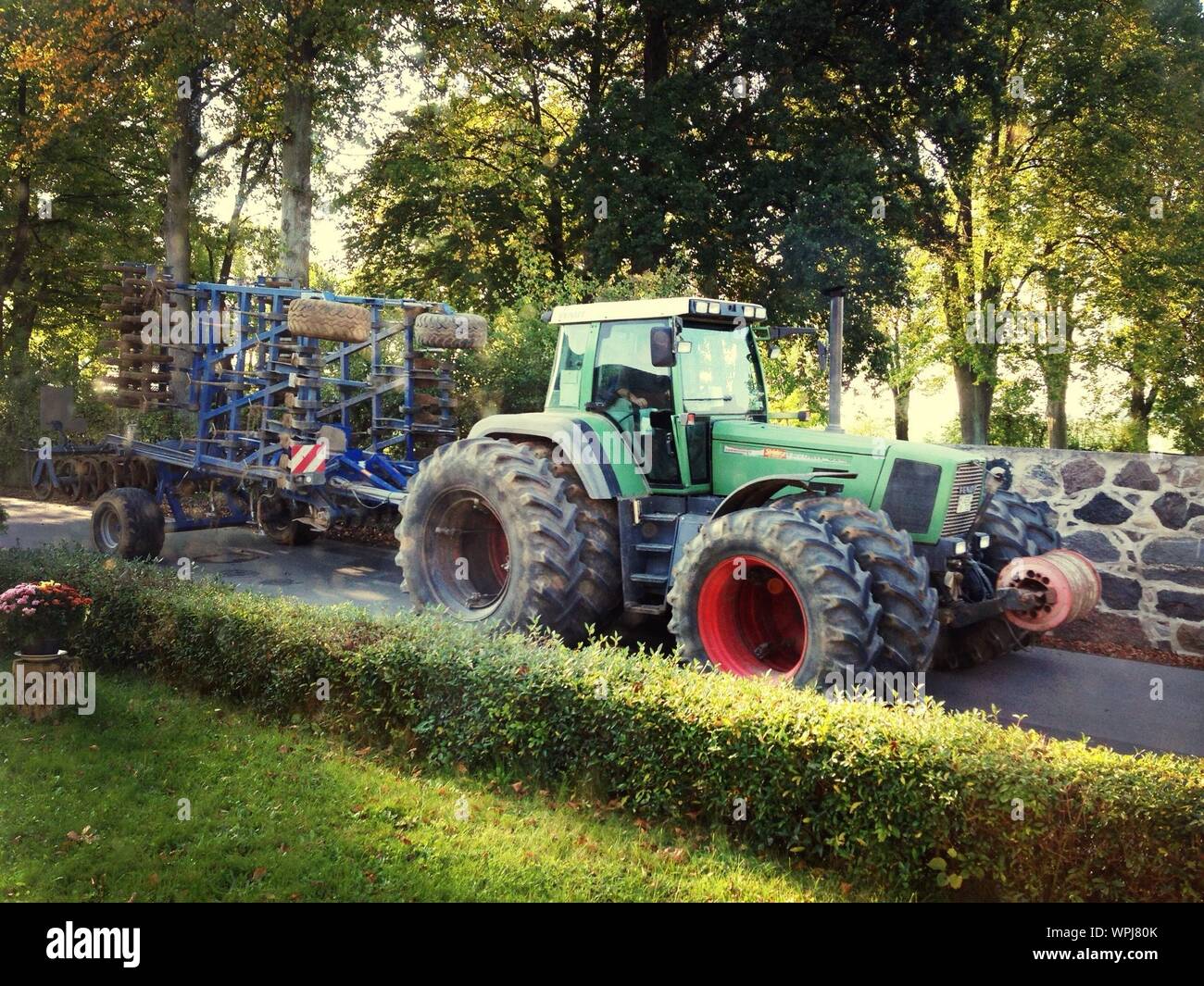 Green Tractor With Trailer Stock Photo - Alamy