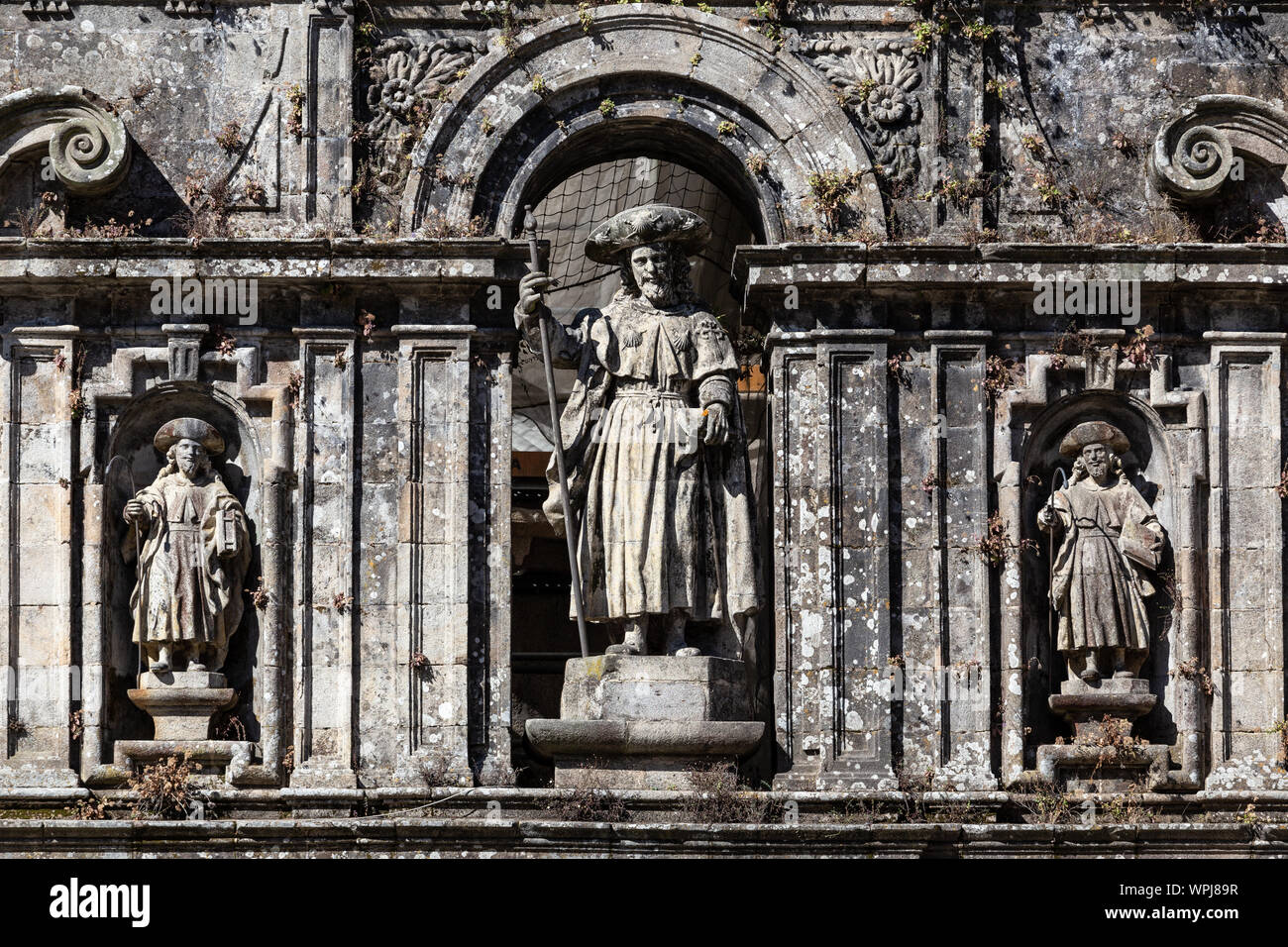 Sculpture of the Apostle Santiago and his disciples. East facade of Santiago de Compostela cathedral Stock Photo