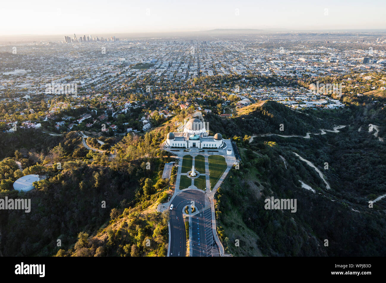 Early morning aerial above popular Griffith Park in Los Angeles, California. Stock Photo