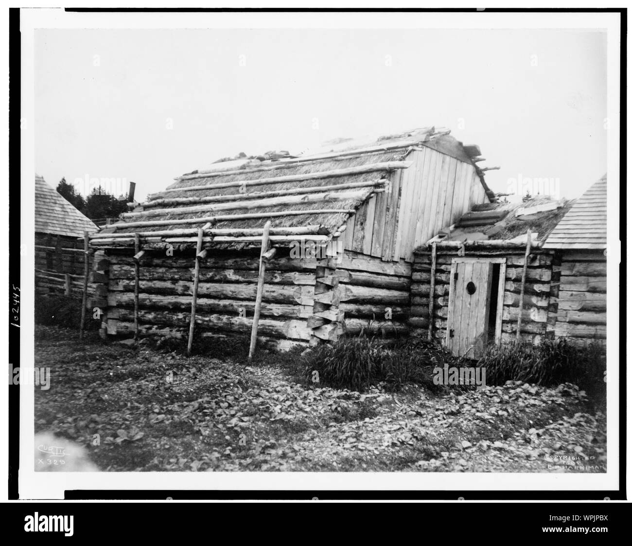 Log Cabins Or Barabara Kodiak Alaska Curtis Stock Photo