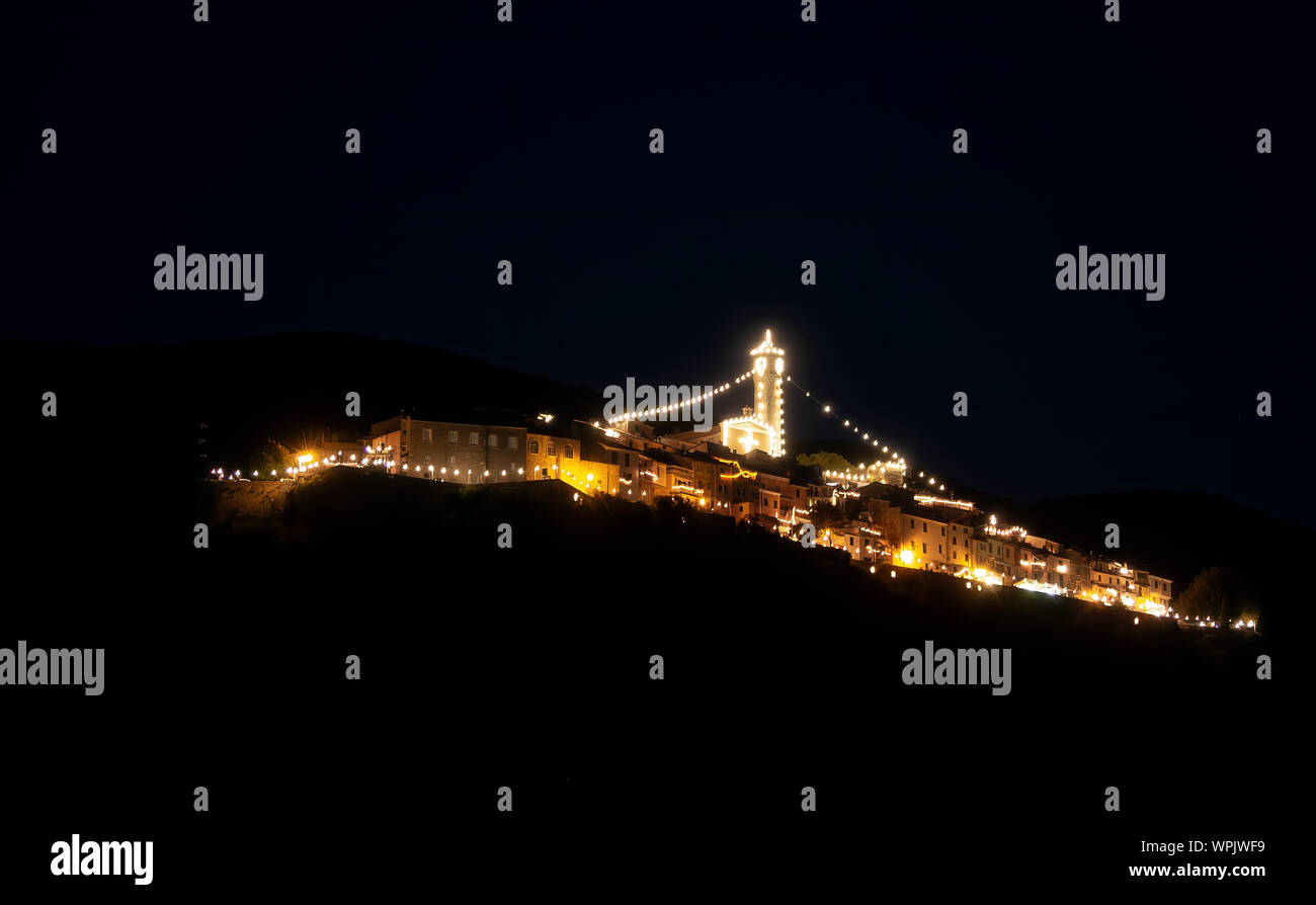 CAPRIGLIOLA, Nr AULLA, ITALY - SEPTEMBER 7, 2019: The hilltop village with lights like a ship for the annual festival of Our Lady of Good Counsel. Stock Photo