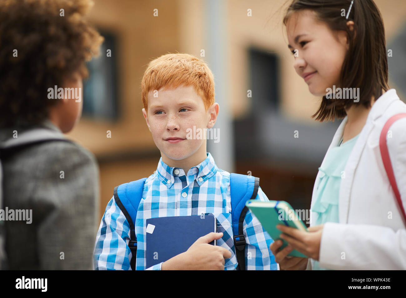 Girls talking school uniform hi-res stock photography and images - Alamy