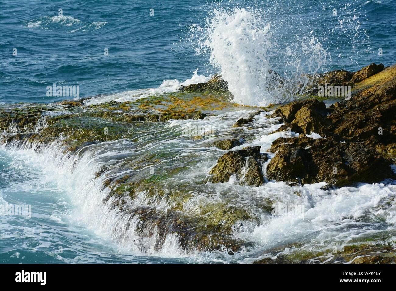 Waves Breaking On Rocks Stock Photo
