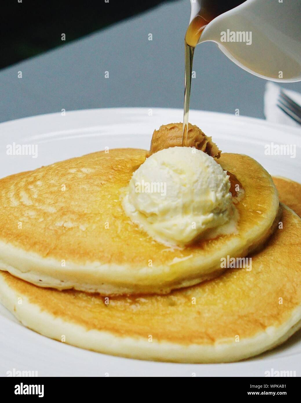 Pancake pouring syrup hires stock photography and images Alamy