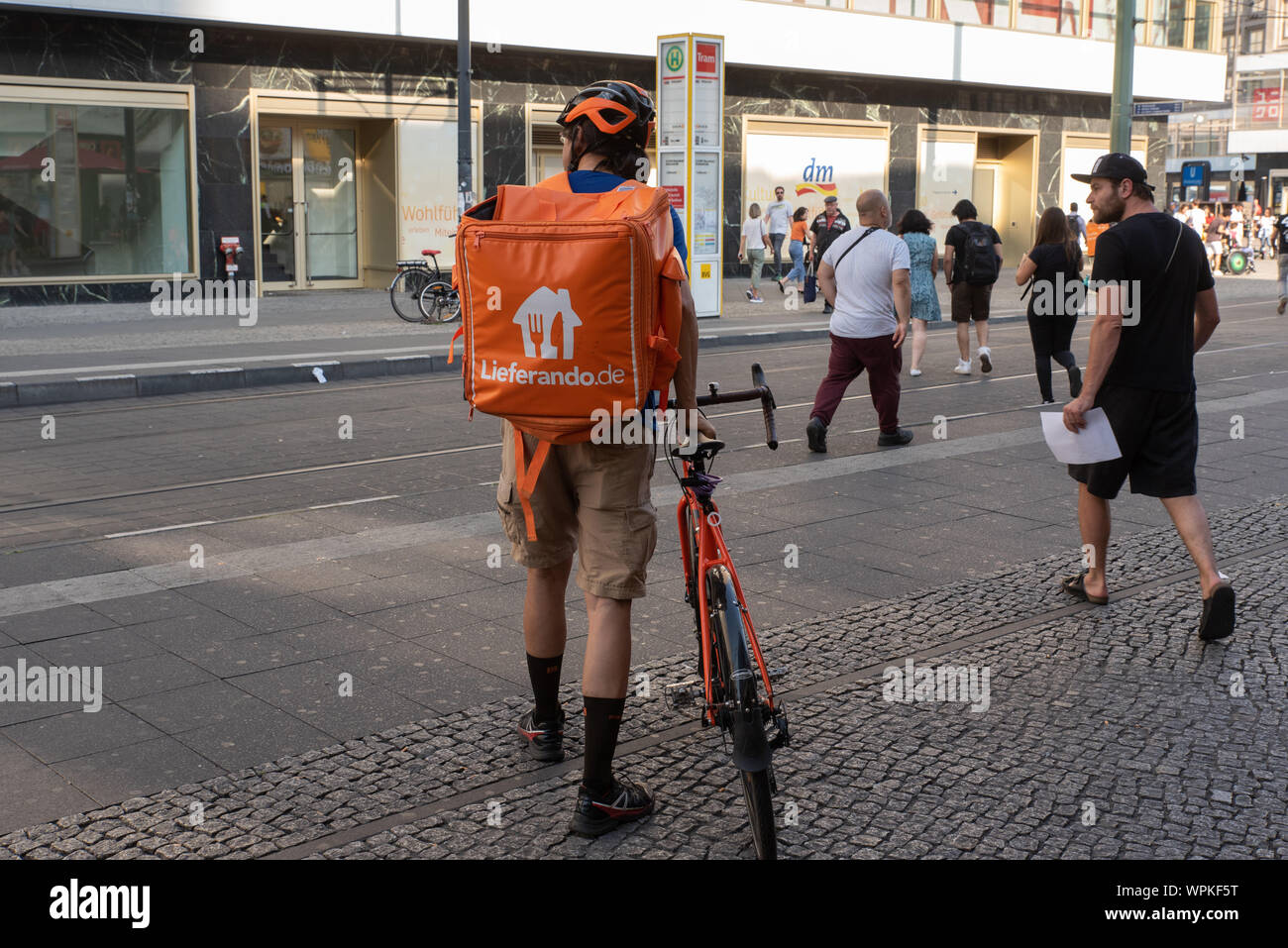 Lieferando worker in Berlin. It remains the only on-demand food delivery company in Germany after Deliveroo decided to stop operating in the country. Stock Photo